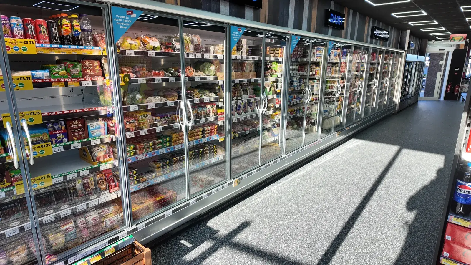 Three 3.75-metre Arneg Osaka multidecks fully stocked on the new sales floor
