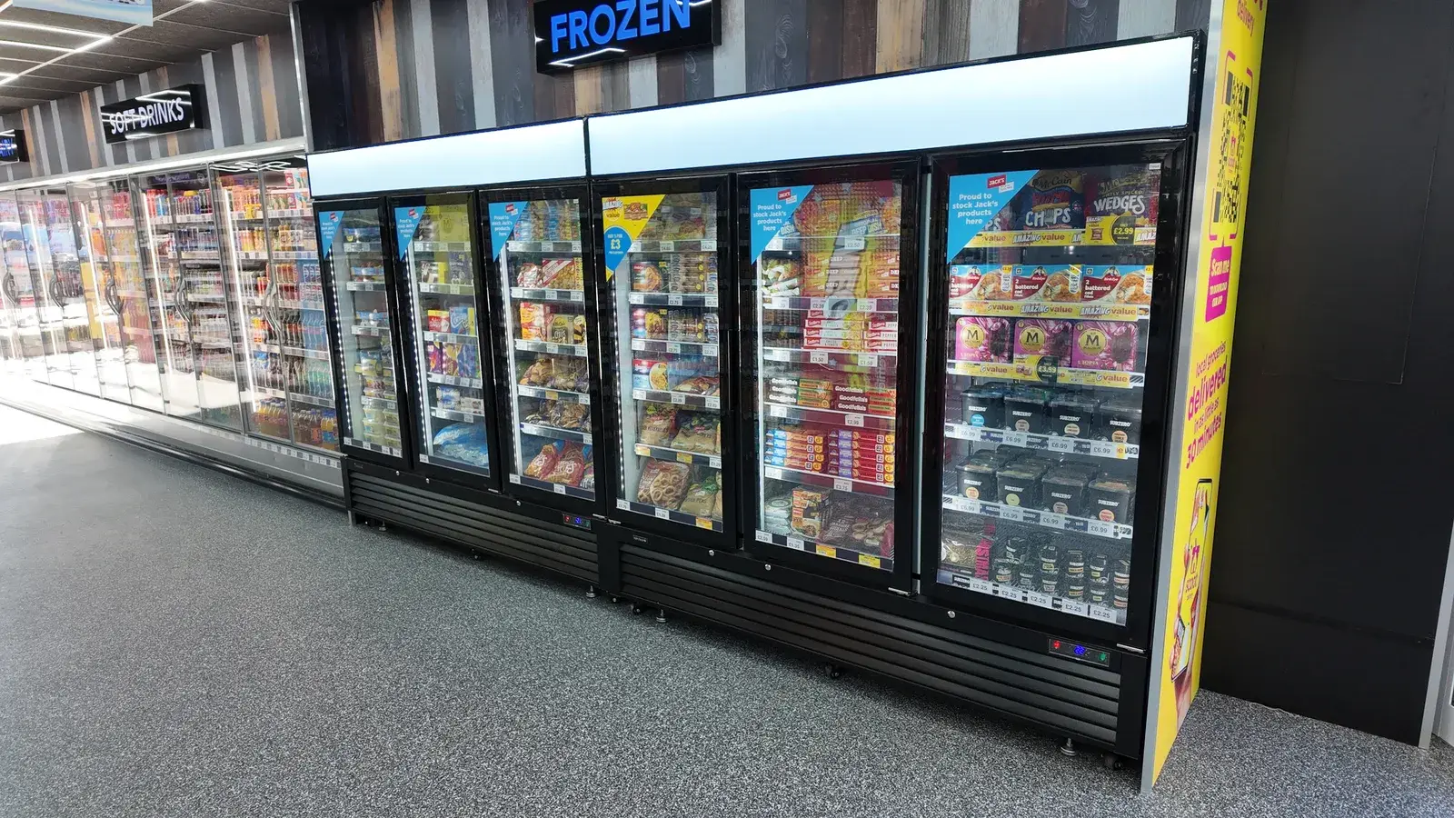 LGF 7500 glass door freezers under the FROZEN sign